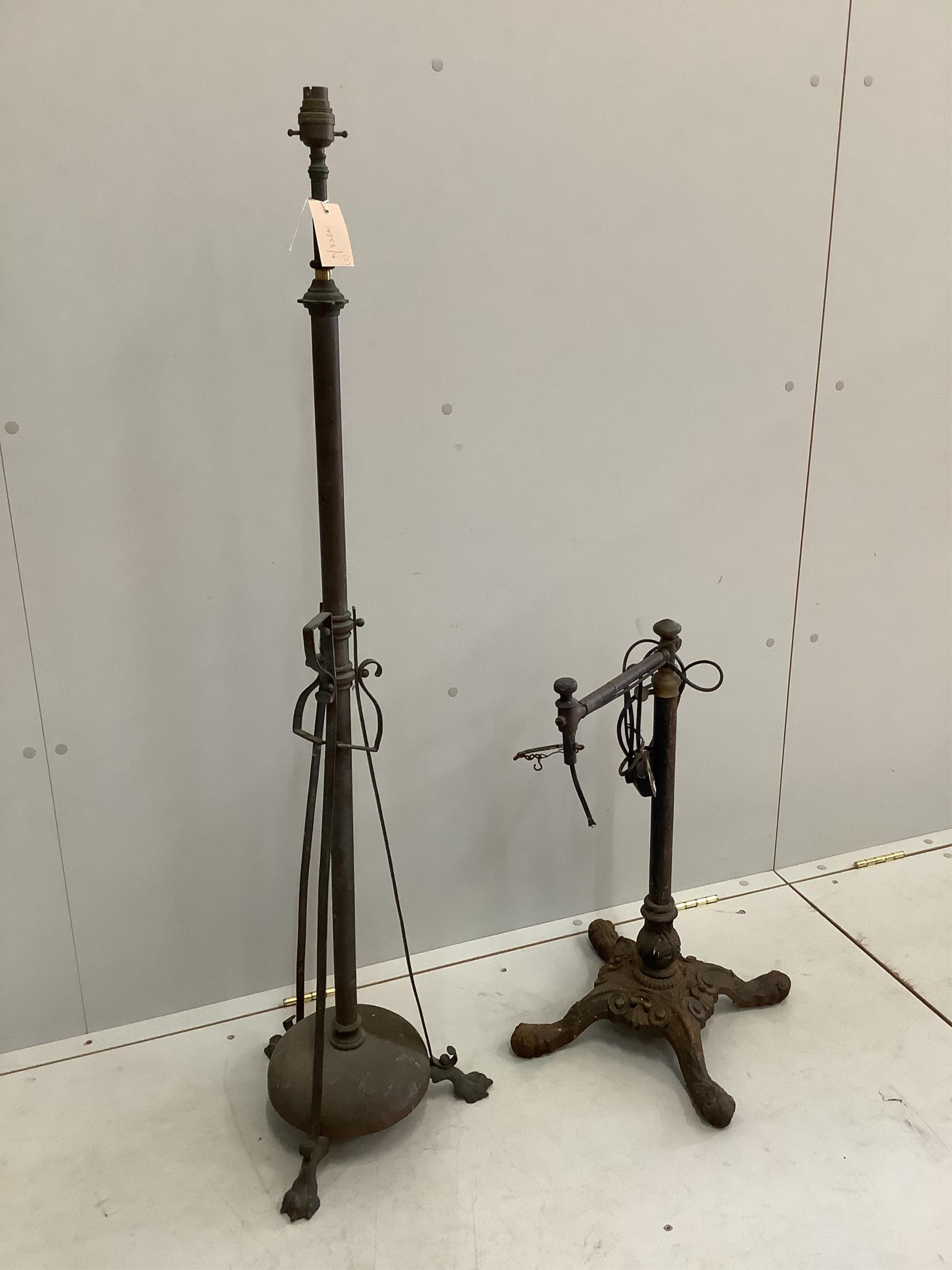 A Victorian brass telescopic standard lamp and a cast iron floor lamp. Condition - poor